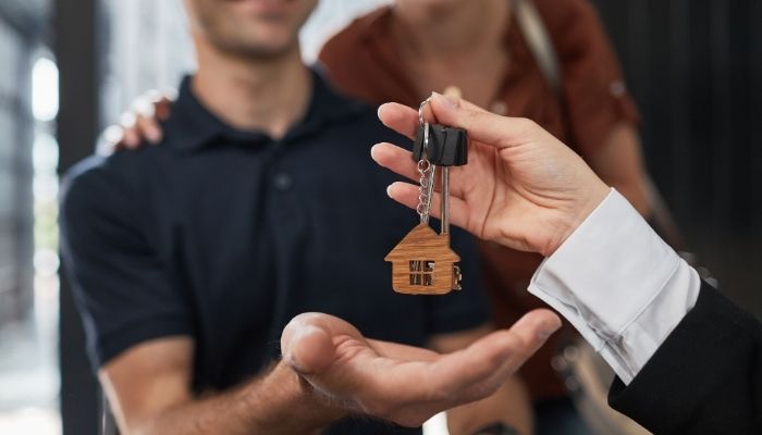 Toronto housing market shift — happy homebuyers celebrating new purchase in the GTA.